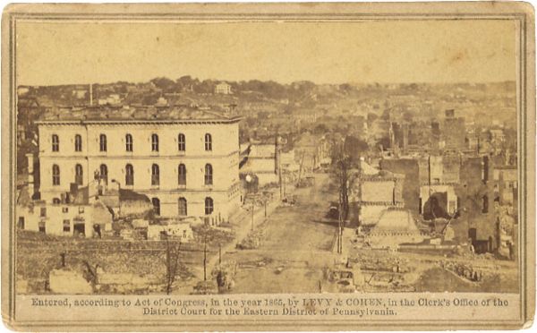 “LEVY & COHEN’S / Views of the Rebel Capital and Its Environs” original labeling on reverse of this 1865 dated photographic carte-devisite view of remains of buildings in the city of Richmond, Virgin