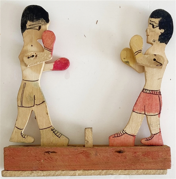 Two Wooden Boxers Facing Off